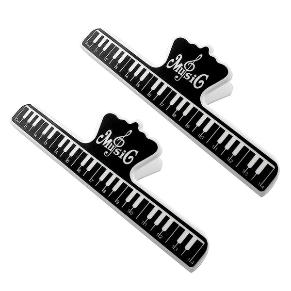 Two black and white piano key rulers